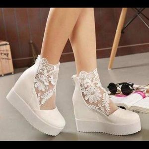 Bridal shoes. Worn only once. It also has a hidden heel.